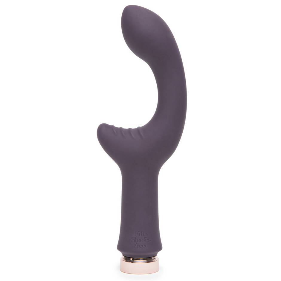 The |Lovehoney Fifty Shades Freed Lavish Attention vibrator. A half moon shaped vibrator with a handle in a lovely plum colour;.
