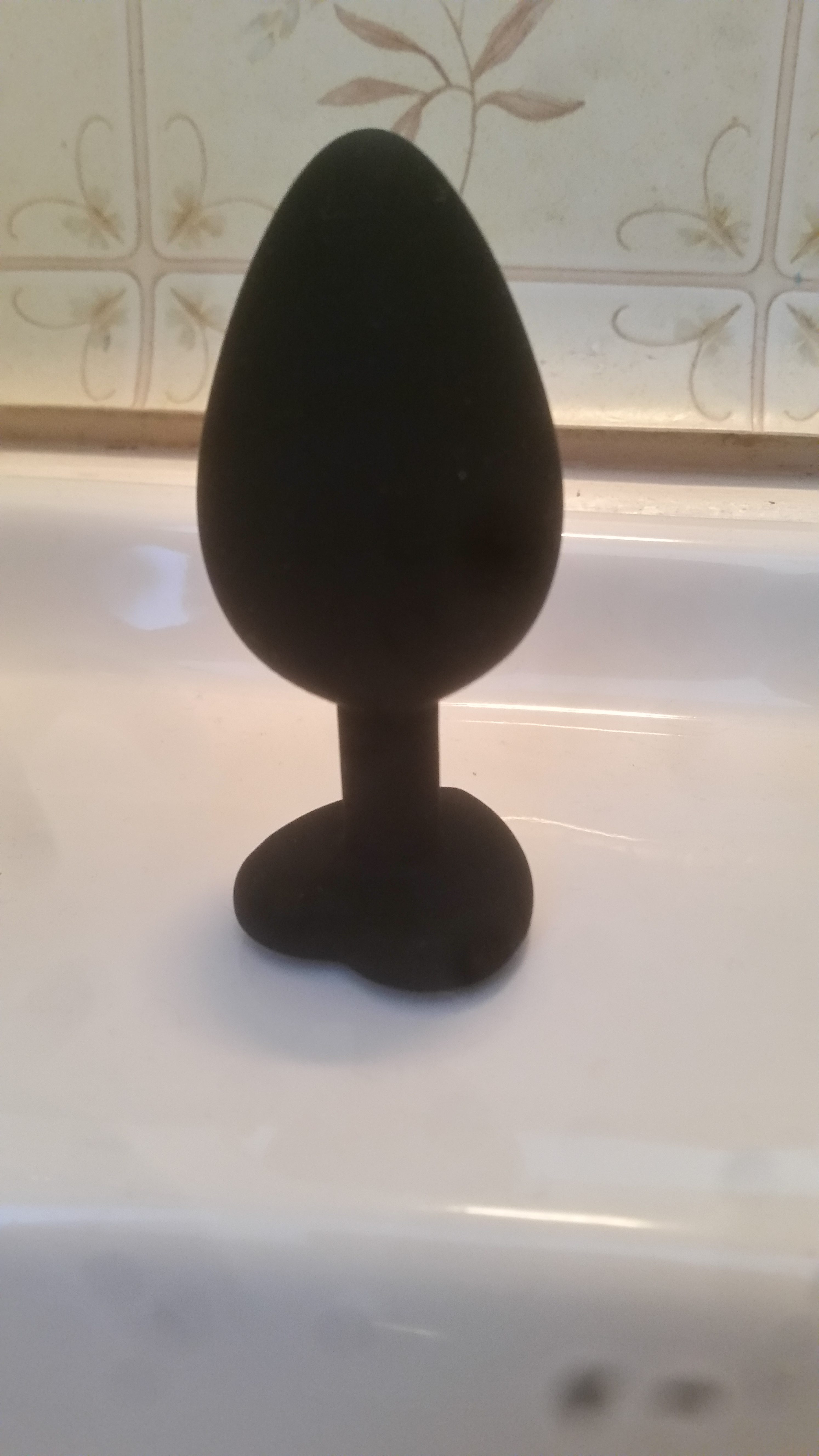The Temptasia Bling Bling butt plug on a bathroom sink.