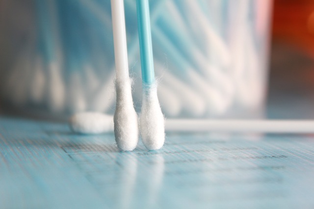 Two medical swabs face down on a surface. For a post on cervical smear tests.