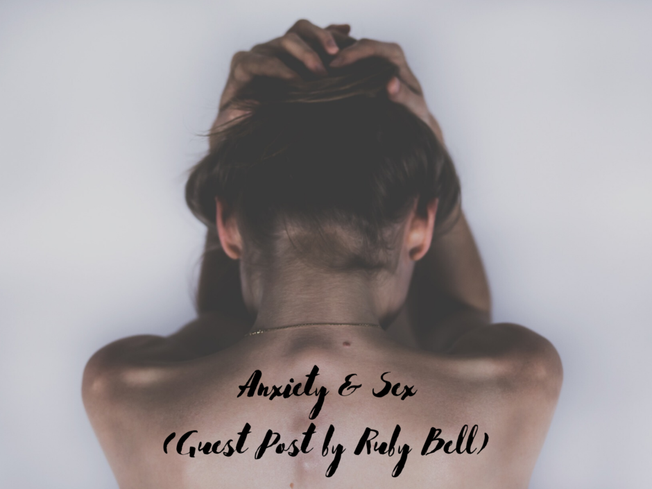 A woman facing away with her head in her hands. For a guest post by Ruby Bell on anxiety and sex