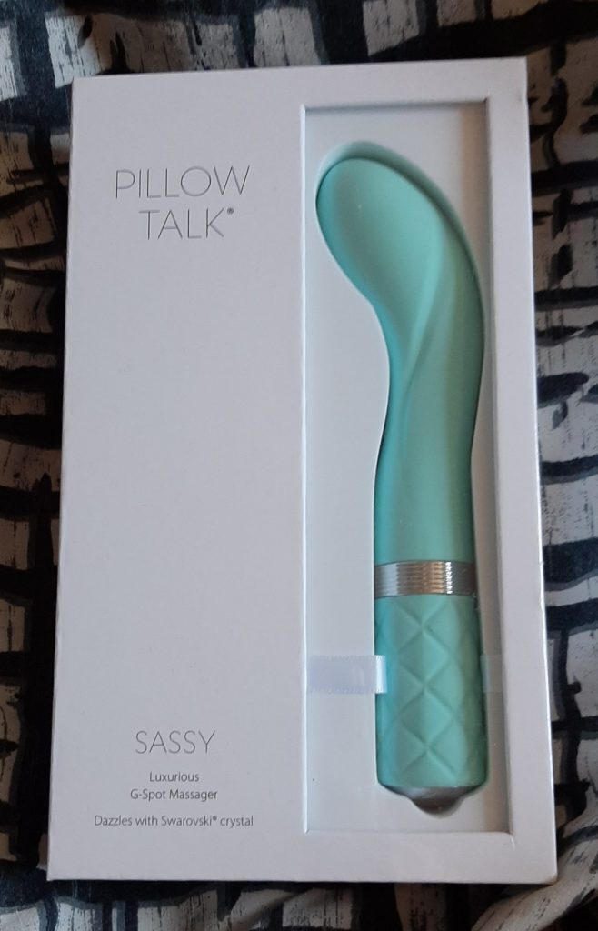 The Pillow Talk Sassy in its white, clear front box