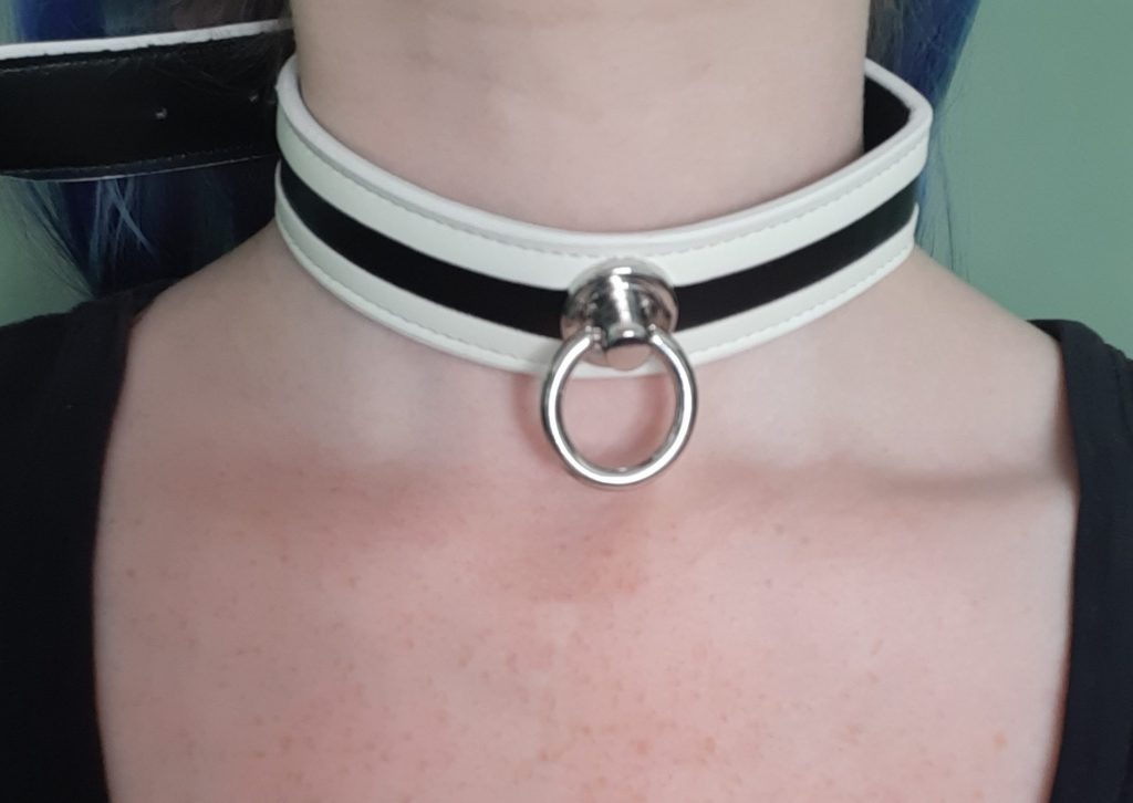 Woman wearing a BDSM faux leather collar vegan leather