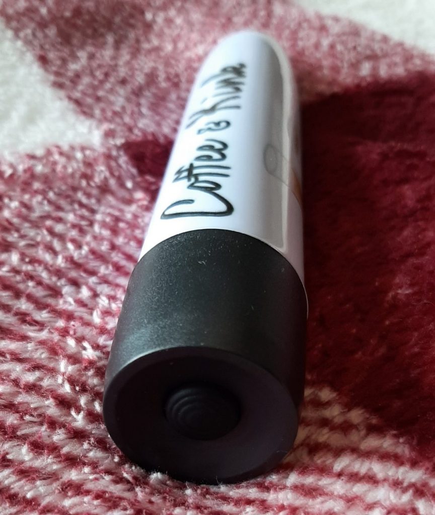 Bullet vibrator with custom printing and button in base