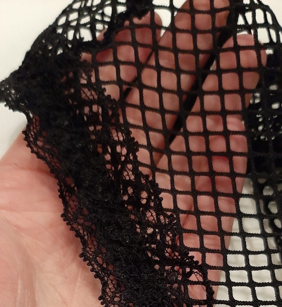 Close up of Lovehoney Provocatease black fishnet and lace bodysuit