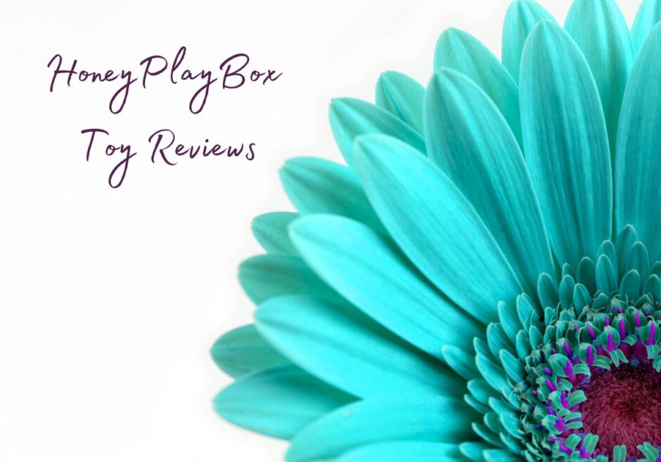 Close up of a turquoise flower. Text reads: HoneyPlayBox Toy Reviews