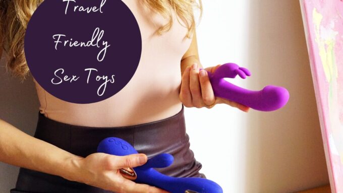A woman holding two rabbit vibrators, one pink and one blue. Caption reads: Travel friendly sex toys. Header image for a post about how to bring adult toys on a plane and other travel hacks.