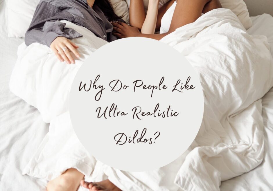Two women in bed together with just their arms and part of their torsos showing above a white blanket. Text reads "why do people like ultra realistic dildos?"