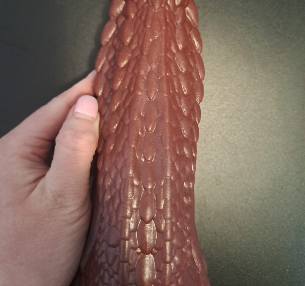 Close up of scales on Mr Hankey's dragon adult toy 