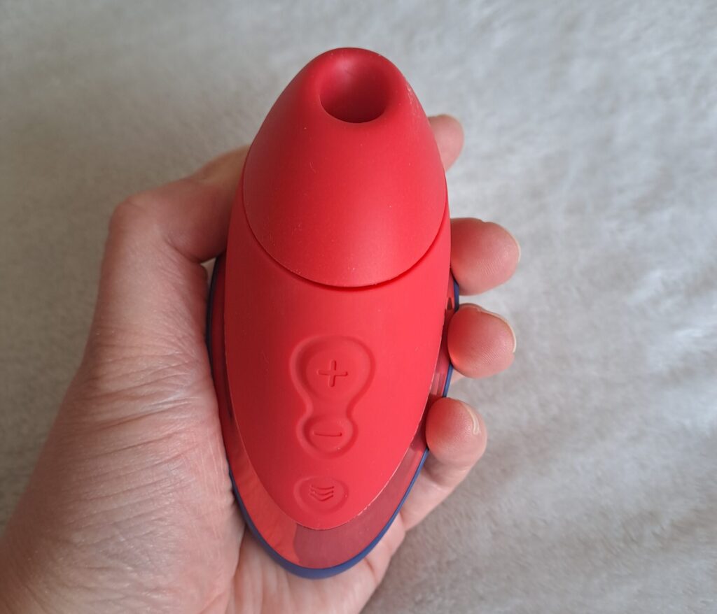 Womanizer Liberty Next held in a woman's hand