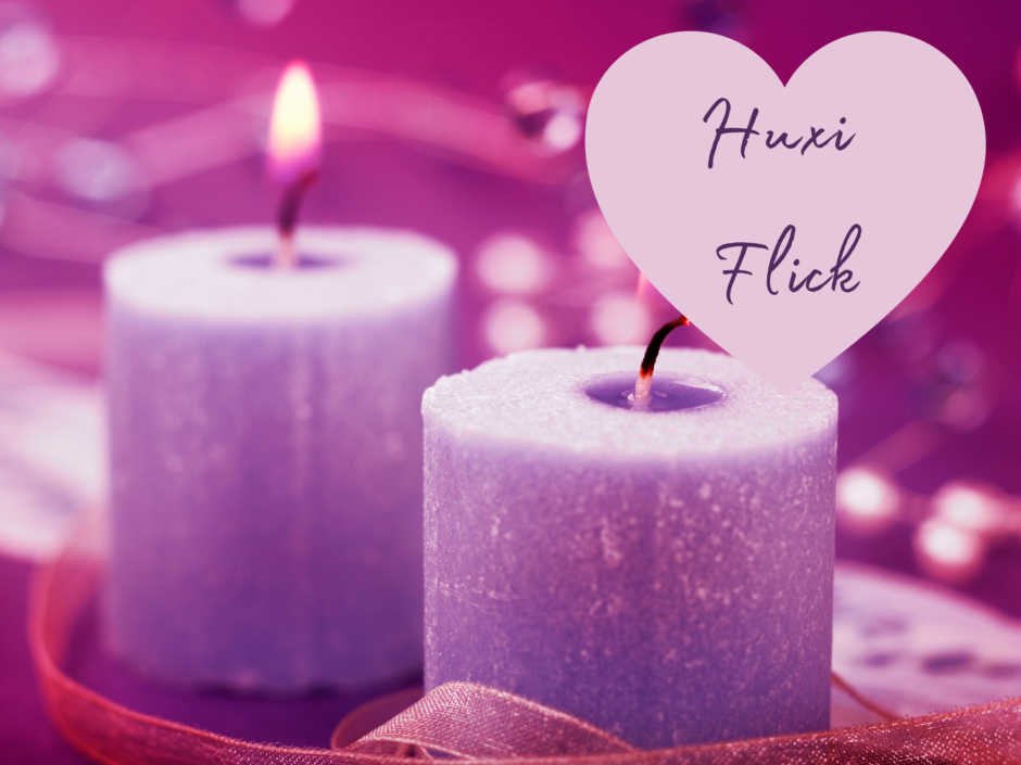 Two lit purple candles. Text reads: Huxi Flick